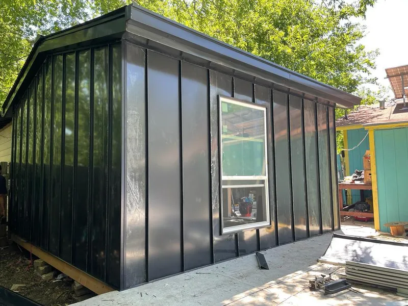 Black standing seam metal wall panels for Roof Inspection in Farragut