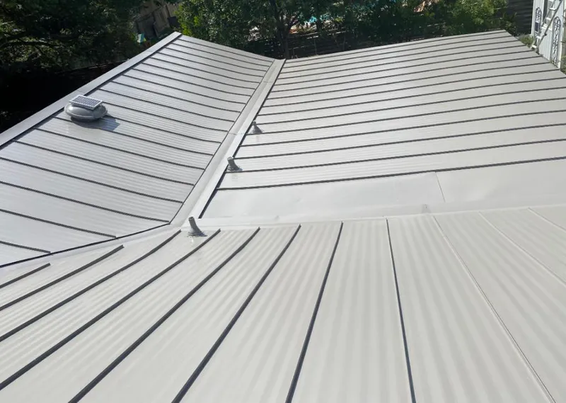 Solar attic fan installed on a metal roof for Roof Ventilation in Farragut
